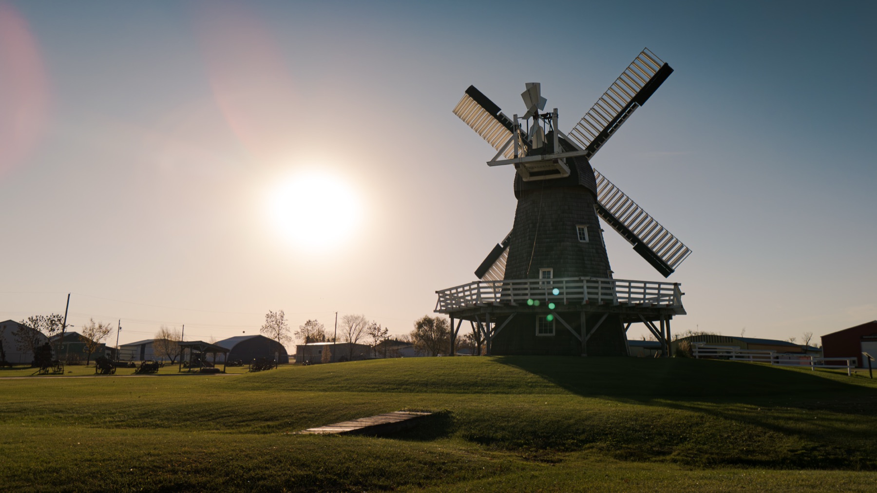 Aerial drone photo of the windmill at Mennonite Heritage Village at sunset
